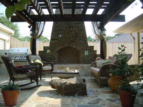 Custom outdoor fireplace built in stone